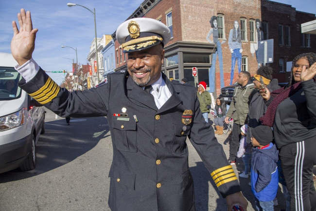 Tory Maye waves to Christmas parade attendees, 2019.