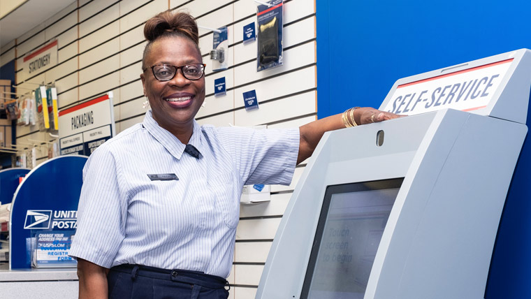 USPS employee inside a retail USPS Post Office.