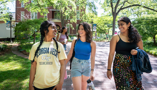 Undergraduate students at Georgia Tech walk on campus near Tech Tower.