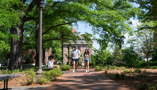 Two undergraduate students walk down a walkway on Georgia Tech’s campus in Atlanta, Georgia.