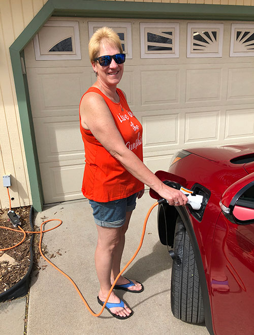 person charging an EV