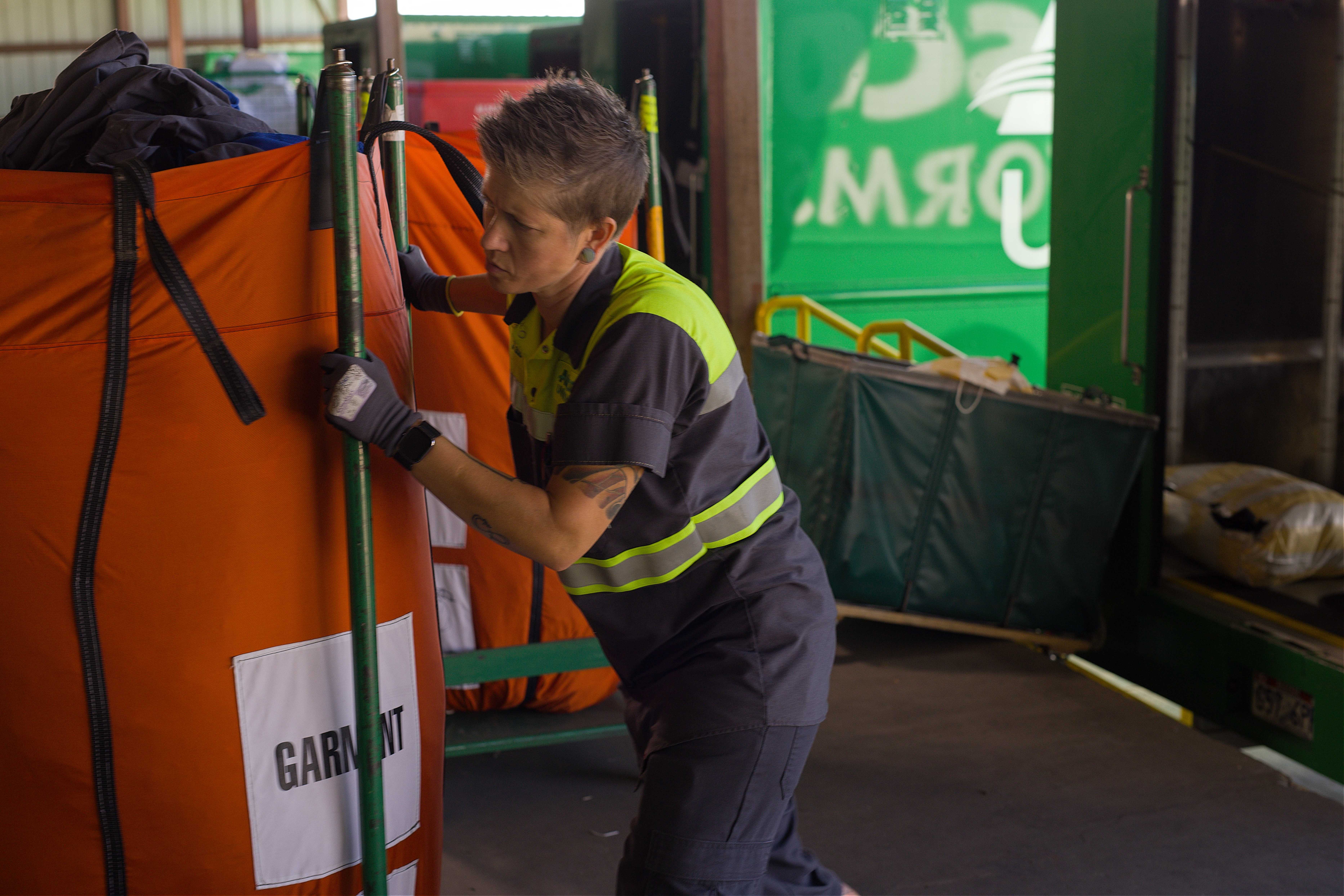 Alsco Uniforms employee moving garments