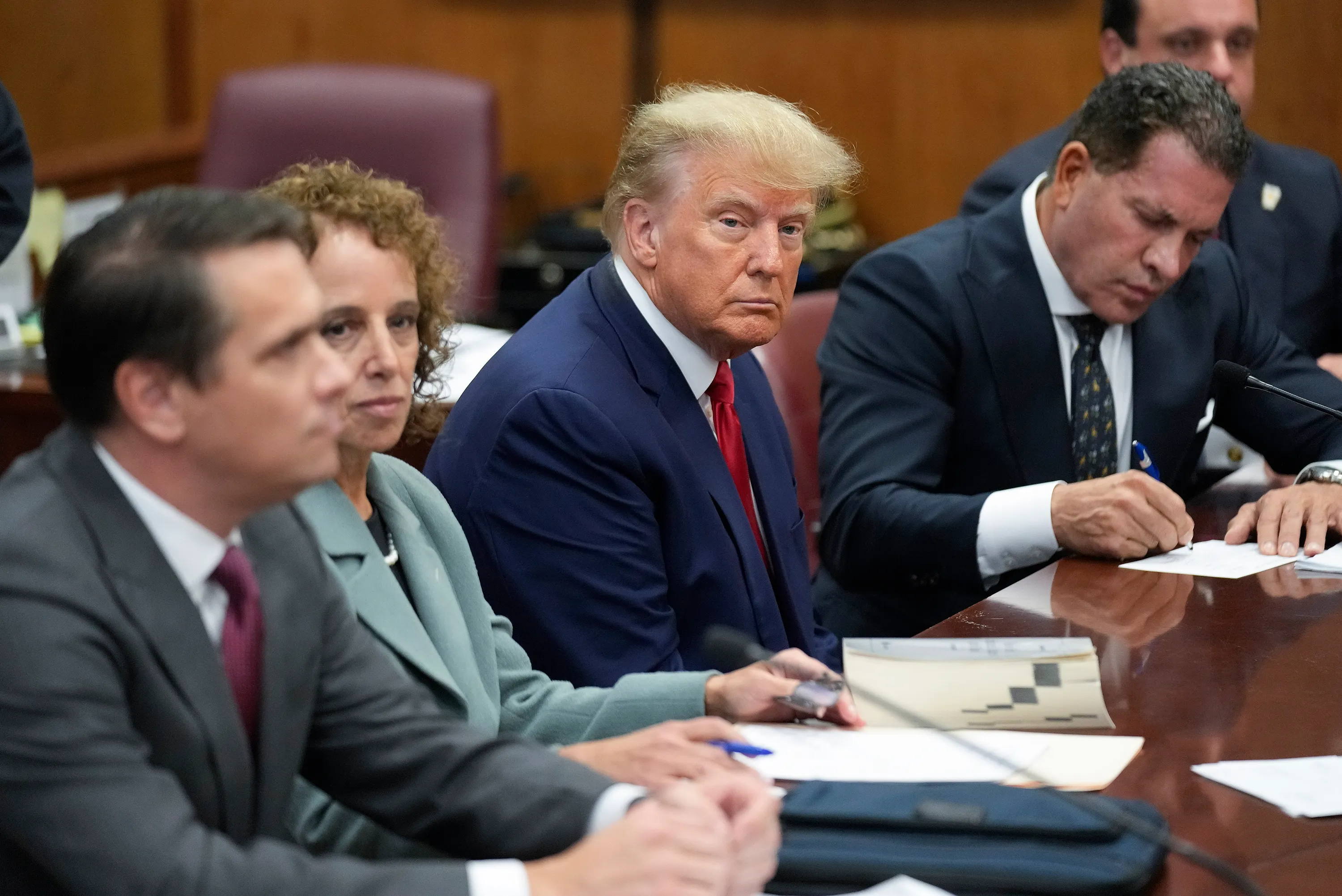 Former President Donald Trump sitting in court.