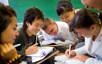 Students working together in a classroom. 