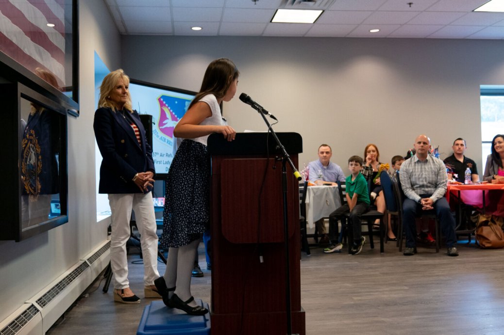 First Lady Jill Biden listens as a military child delivers remarks