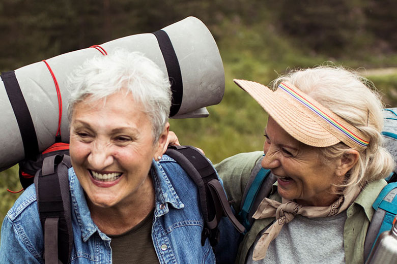 Two Senior Women Hiking Outdoors