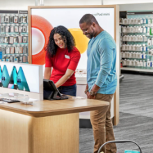 A Target team member helps a guest in electronics