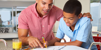 Adult helping child with homework