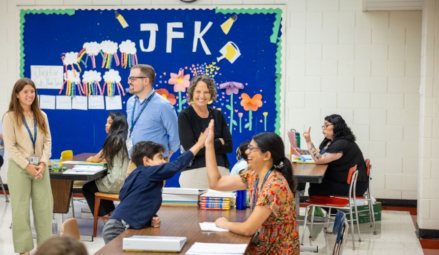 Suzanne Rosenblith observing UB students tutoring local students at Sweethome Elementary School. 