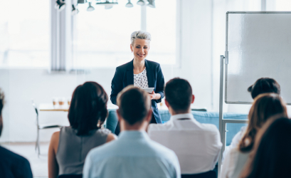 A woman is leading a training class