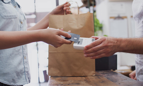 A customer making a purchase with a credit card.