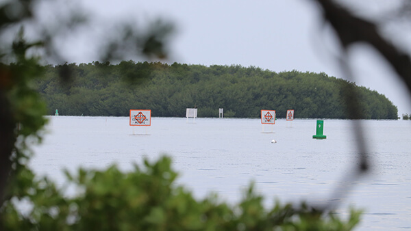 A series of navigational signs in nearshore waters