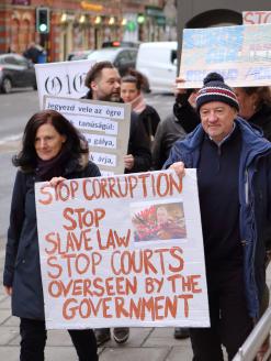 Hungarian people living in the English city marched silently through the streets in a show of solidarity with protesters in Hungary.  Bristol, England. 16 December 2018. Editorial credit: tviolet / Shutterstock.com