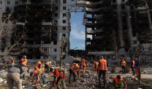 Volunteers clean up the rubbles from a destroyed residential building in Borodyanka. Following the recapture of Borodyanka by the Ukrainian forces, the city was heavily devastated and turned into ruins under intense fighting and shelling.