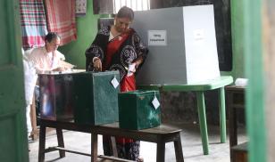 A woman casts her vote in West Bengal's local elections on the outskirts of Kolkata