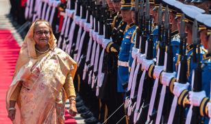 Bangladesh's prime minister Sheikh Hasina inspects the guard of honor during a welcoming ceremony at Government House