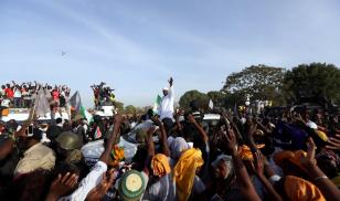 Gambia's President Adama Barrow, who was sworn in at the Gambian embassy in neighbouring Senegal, greets his supporters upon his arrival from Dakar, in Banjul, Gambia January 26, 2017.