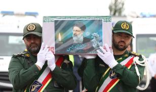 Honor guards carry the coffin of late president Ebrahim Raisi during a funeral procession at Mehrabbad Airport in Tehran, Iran, on Tuesday, May 21, 2024. 