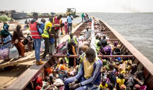 Boats transfer South Sudanese returnees, who fled both South Sudan's war and the more recent war in Sudan, back to their original homes  to be reunited with family members.