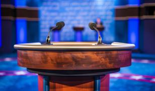 A podium with microphones set up for the presidential debate