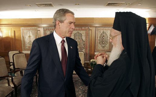 President George W. Bush talks with Ecumenical Patriarch Bartholomew I after meeting with religious leaders in Istanbul, Turkey, Sunday, June 27, 2004. White House photo by Eric Draper.