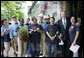 President George W. Bush stands with employees during a visit to Frager's Hardware store in the Capitol Hill neighborhood of Washington, D.C., Friday, May 5, 2006.  White House photo by Eric Draper