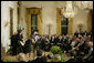 President George W. Bush, Mrs. Laura Bush and their invited guests listen to country singer Kenny Chesney perform in the East Room of the White House Tuesday evening, May 16, 2006, at the official dinner for Australian Prime Minister John Howard and Mrs. Janette Howard. White House photo by Paul Morse