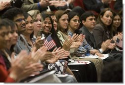 Arlene Oftedahl of Burke, Va., center, is all smiles as she and some of America’s newest citizens applaud Mrs. Cheney as she delivers her remarks during a special naturalization ceremony at the National Archives Tuesday, April 17, 2007, in Washington, D.C.  