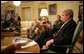 President George W. Bush delivers a statement on the War in Iraq during a visit Monday, April 23, 2007, by Gen. David Petraeus, Commander of the Multinational Force-Iraq, to the White House. Said the President, "I will strongly reject an artificial timetable withdrawal and/or Washington politicians trying to tell those who wear the uniform how to do their job." With them is Gen. Peter Pace, Chairman of the Joint Chiefs of Staff, left, and Gordon England, Deputy Secretary of Defense.  White House photo by Eric Draper