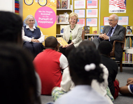 Mrs. Lynne Cheney speaks to students from Ambassador Baptist Christian School, Wednesday, July 11, 2007, at the Anacostia Interim Public Library in Washington, D.C. During Mrs. Cheney's visit the National Endowment for the Humanities announced that all D.C. public libraries will receive this year's We the People Bookshelf, a collection of classic books with themes related to American ideas and ideals. Seated with Mrs. Cheney are Chief Librarian of the D.C. Public Libraries Ginnie Cooper and Chairman of the National Endowment for the Humanities Bruce Cole. White House photo by David Bohrer