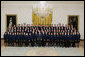 President George W. Bush joins the National and State Future Farmers of America organization members for photo Thursday, July 26, 2007, in the East Room of the White House. The mission of the FFA is to help students develope their potential for leadership, personal growth and career success through agricultural education. White House photo by Joyce N. Boghosian