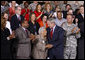 President George W. Bush embraces New Orleans chef and restaurant owner Leah Chase following his address Wednesday, Aug. 20, 2008 at the historic Jackson Barracks in New Orleans, where President Bush honored residents and community leaders for their determination to rebuild their communities three years after Hurricane Katrina devastated the Gulf Coast region. White House photo by Eric Draper