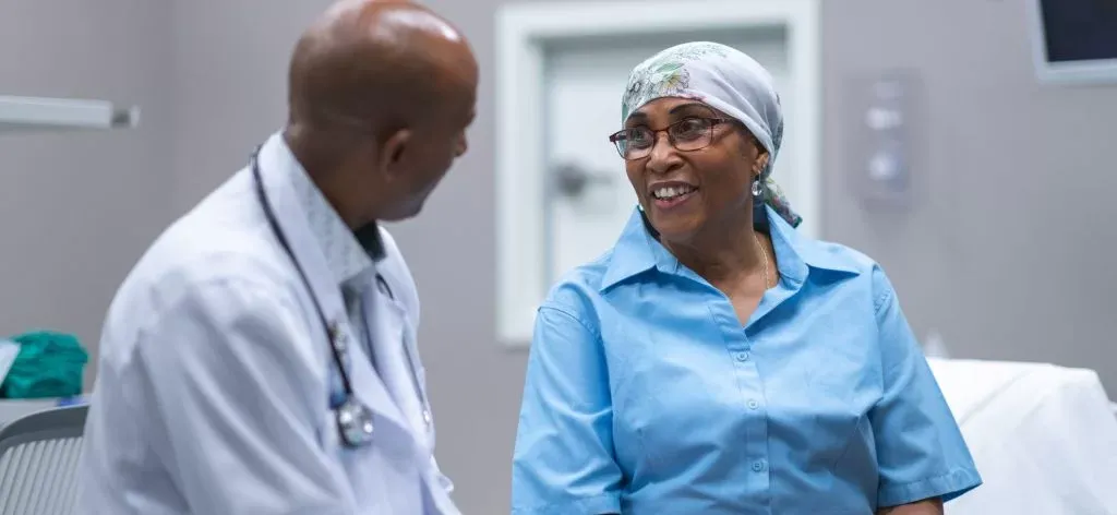 A Doctor And Patient Talking To Each Other