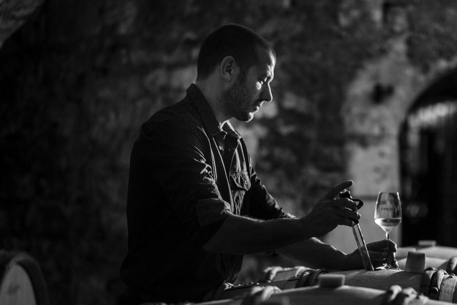 Benoit Droin drawing samples at the winery