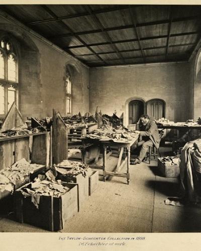 Solomon Schechter studying the fragments of the Cairo Genizah