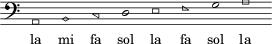 \relative c' { \clef bass \key a \minor \override Staff.TimeSignature #'stencil = ##f \cadenzaOn 
\southernHarmonyHeadsMinor a,1 b c d e f g a } \addlyrics { la mi fa sol la fa sol la }