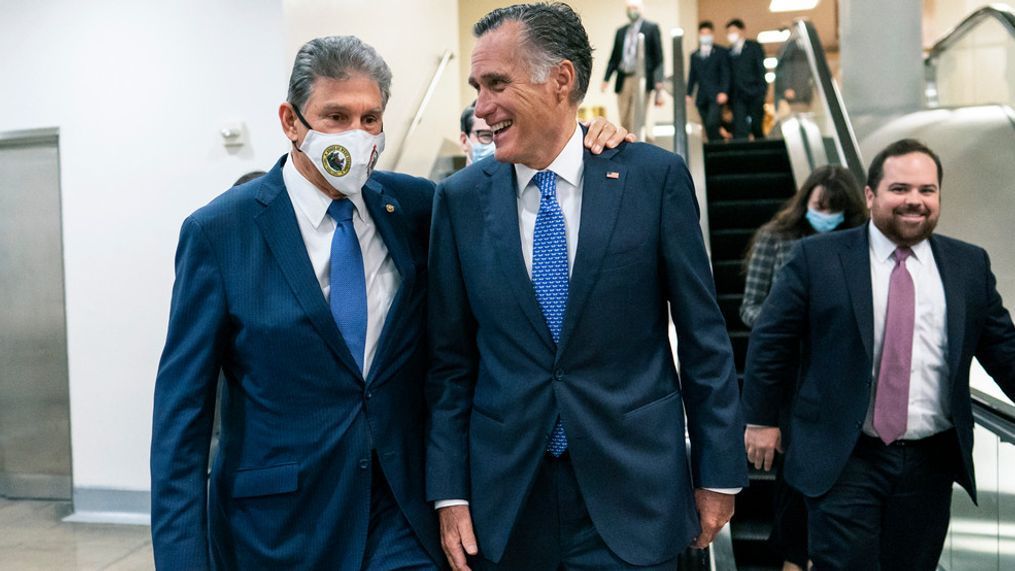 Sen. Joe Manchin, D-WVa., left and Sen. Mitt Romney, R-Utah, walk together on Capitol Hill in Washington, Thursday, Nov. 4, 2021. (AP Photo/Carolyn Kaster)