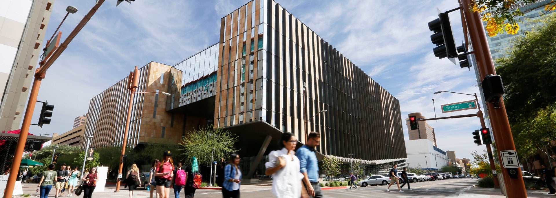 Street view of people walking outside of the Beus Center for Law and Society, home to ASU's Sandra Day O'Connor College of Law.