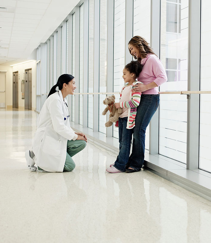 Doctor with mom and daughter