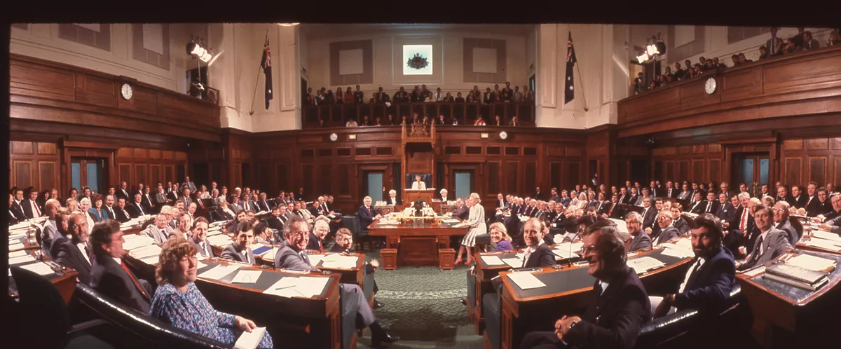 A colour photograph of the House of Representatives Chamber filled with seated politicians