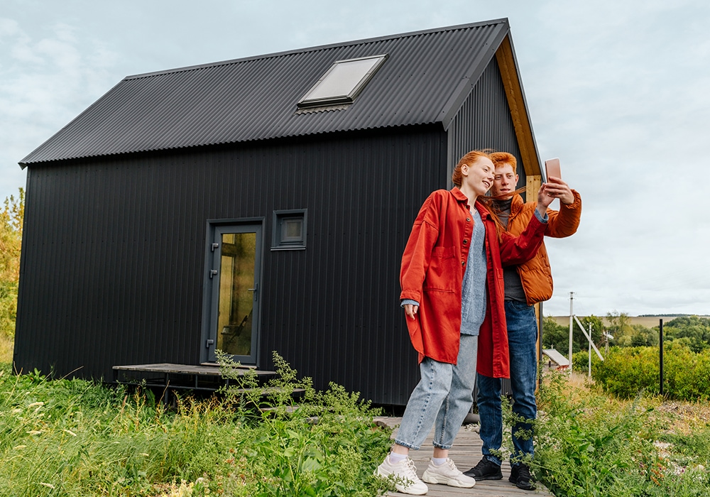 brother and sister checking fibre speed in a rural house