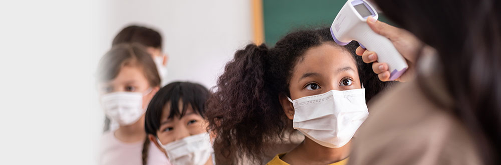 Students waiting in line to get temperature taken