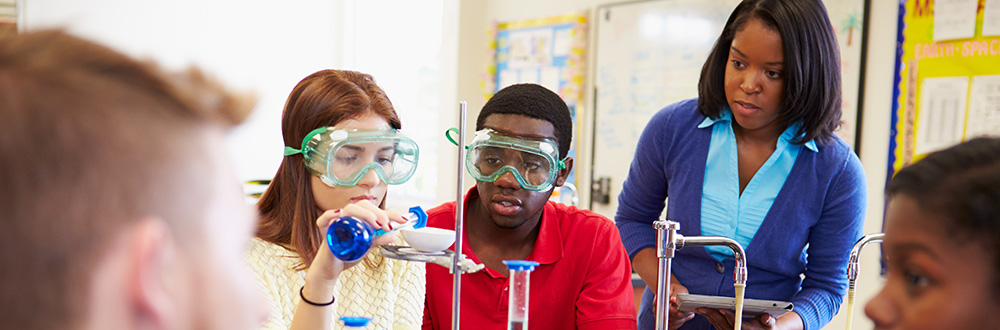 Teacher working with a student, one on one.