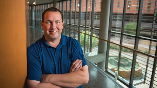 Matt Carter poses inside W. P. Carey's McCord Hall