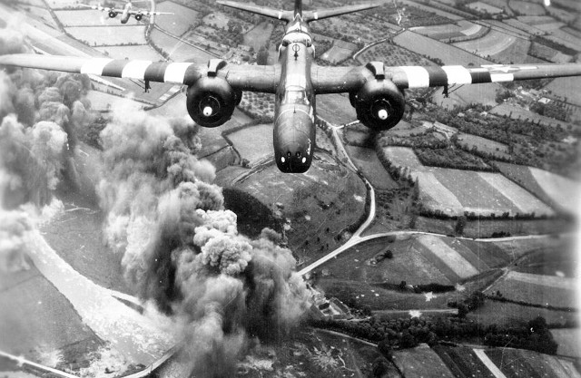 An A-20 bomber from the 416th Bomb Group of the U.S. completing its bombing run, June 1944.