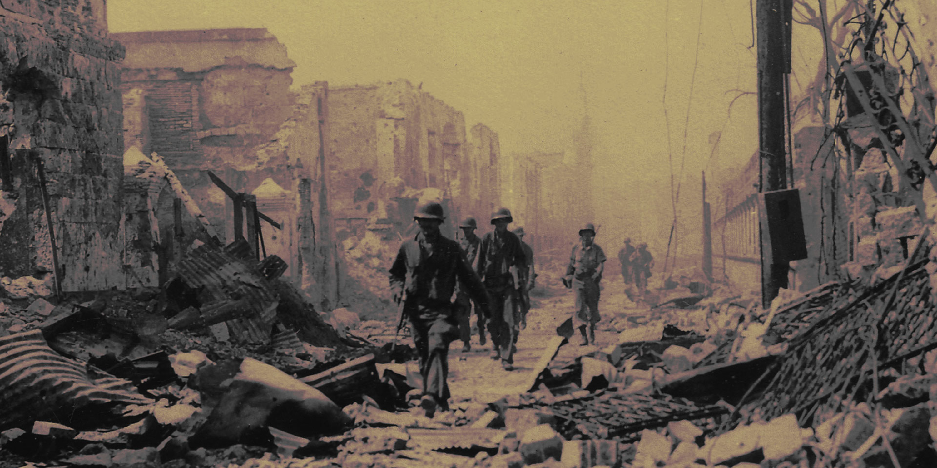 U.S. soldiers walking through rubble in Manila