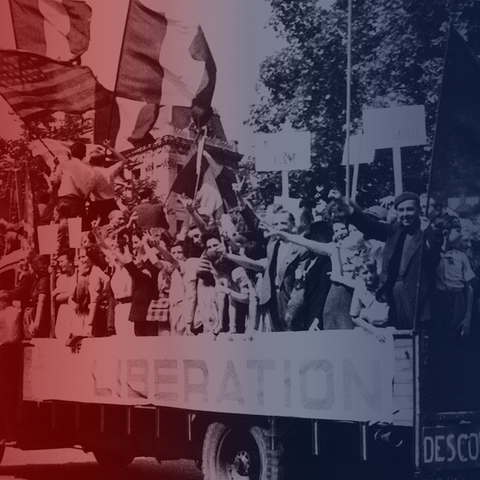 French people waving flags and holding "Liberation" sign