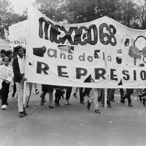 Students in Mexico protest the PRI in 1968 with a sign that reads "Mexico '68: The Year of Repression."