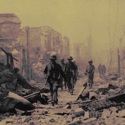 U.S. soldiers walking through rubble in Manila