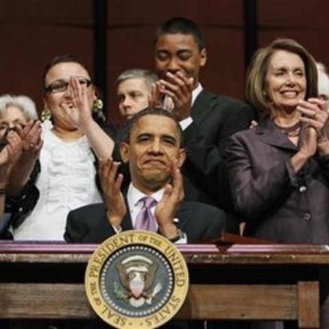 President Obama signing the new student loan legislation in March 2010.